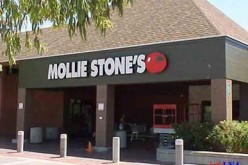 Woman robber charges from store into the arms of police