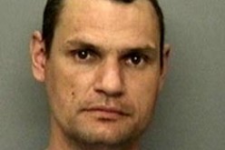 Wanted man found hiding in hot tub