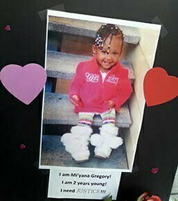 A picture of the victim, Mi'Yana Gregory, is posted at the memorial site.