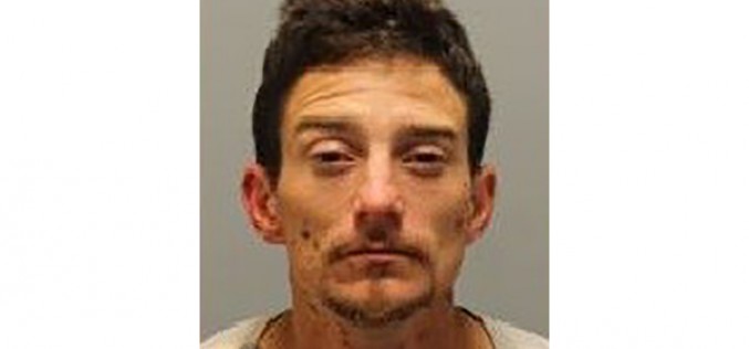 Man Brandishing Stolen Gun Arrested