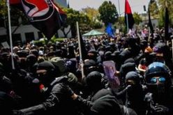 13 Arrests Made During Protests; Officer Injured, Police Hit with Paint