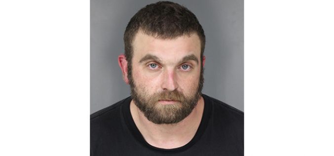 Elk River resident reports suspicious vehicle parked in his driveway; driver arrested on possession charges