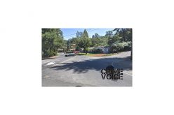 One Person Arrested, One at Large in Armed Robbery