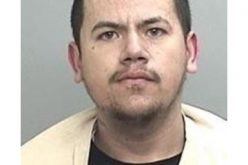 Man is high on the roof, AR-15 in the truck