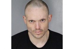 Nodding off in his car with a lot of drugs and two arrest warrants