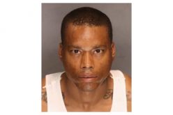 Armed robber flees in car, flees on foot, finds himself in jail