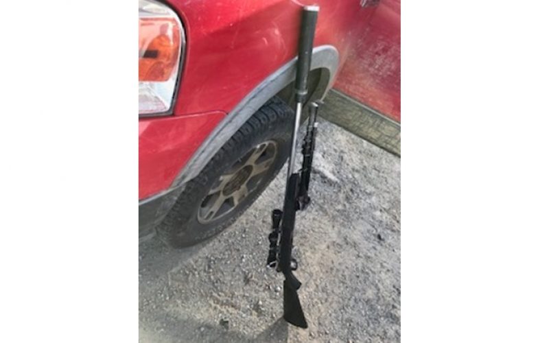 Pair arrested after stolen check, bolt-action rifle found in truck