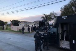 Man arrested after allegedly shooting rifle out of moving vehicle