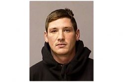 Woman shot during robbery behind bar