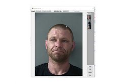 Burglary interrupted, one in custody, one outstanding