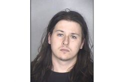 He tried to lift a bottle of liquor from Safeway