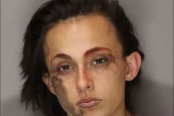 Upset woman breaking glass, yelling profanities