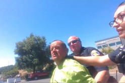 Lying down in a planter box, not wanting to be arrested