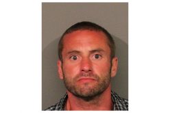 Elderly couple interrupts man walking inside their home