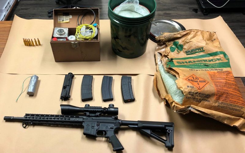 Man with active warrants arrested, gun and explosive materials seized