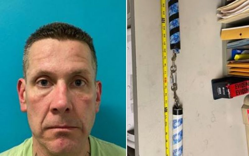 A man at the park, swinging his nunchucks