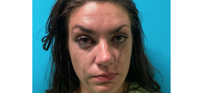 Woman arrested in connection to drugs, stolen gun found in room