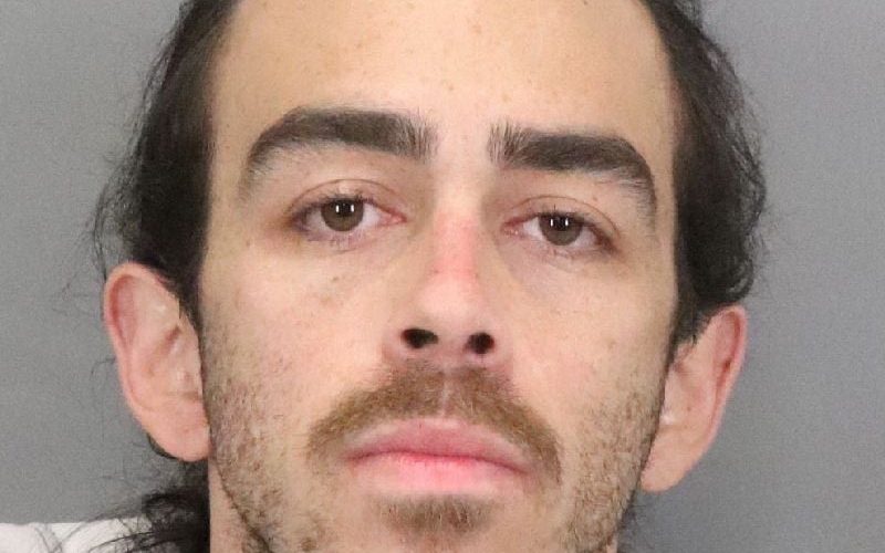 Two people with a lot of checks that don’t belong to them