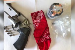 Gang member tries to run with gun, drugs