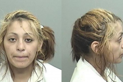 Woman slumped over in her car, under the influence