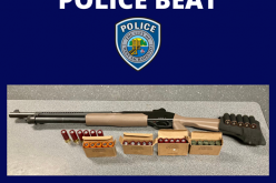 Man walking around with a long gun