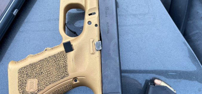 Suspect Arrested in Stolen Vehicle with Unregistered Firearm