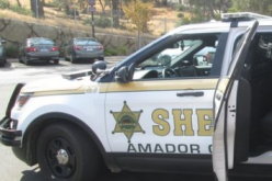 Sorting through a pile of stolen mail in his vehicle