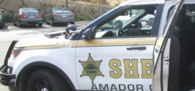 Sorting through a pile of stolen mail in his vehicle