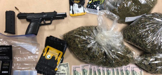 Handgun and drugs found after traffic stop
