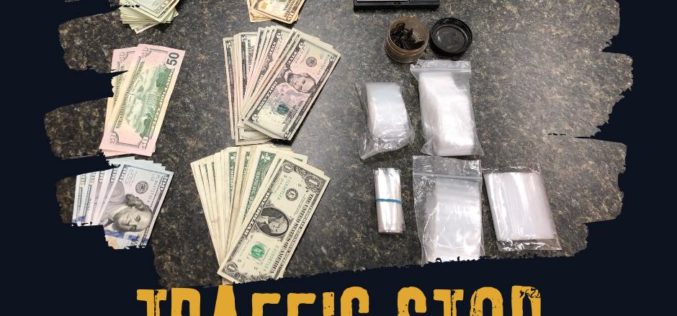 Woman driving with heroin, pipes, cash