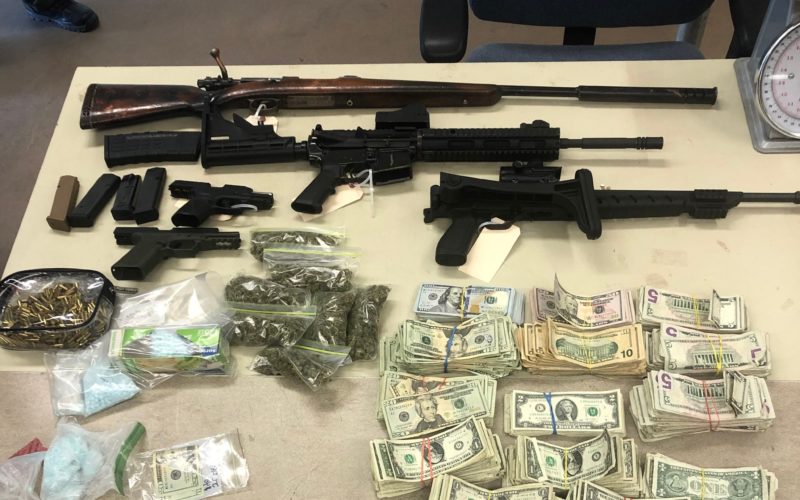 Cache of drugs, cash and five guns