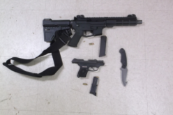 Suspicious man carrying loaded gun, one in his trailer