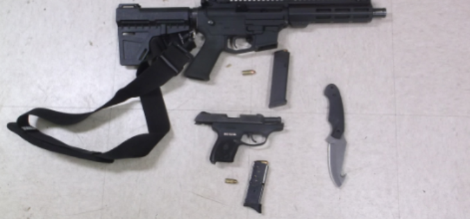 Suspicious man carrying loaded gun, one in his trailer