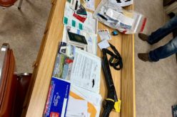 Man arrested with ID cards, checks, titles, badges and more