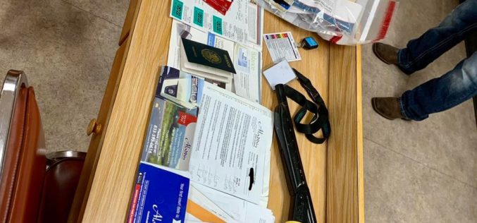 Man arrested with ID cards, checks, titles, badges and more