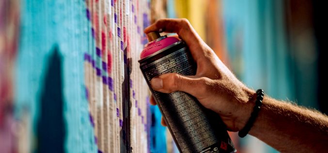 Carjacking suspects arrested after allegedly spray painting stolen vehicle