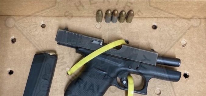 Man arrested after authorities reportedly find loaded, unregistered gun in vehicle
