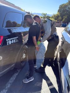 Suspect under arrest | Courtesy of MCSO