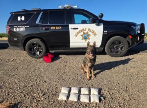 K9 Officer with Drug Evidence | Courtesy of Williams CHP